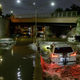 Floodwater surrounds vehicles following heavy rain on an expressway in Brooklyn, New York early on September 2, 2021, as flash flooding and record-breaking rainfall brought by the remnants of Storm Ida swept through the area.